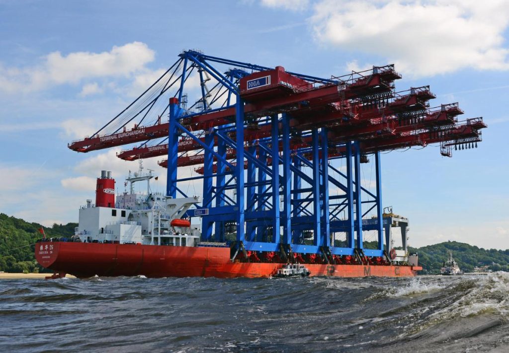 Gantry cranes transportation by a sea-going barge